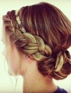 This look can be achieved by adding one or two braids, loosening them up, and lightly pinning  coiled braid into a bun at the nap of your neck..or slightly to the side. Very chic and relly not hard to "Holi do!"