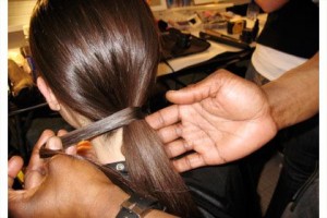 One of Kevin's favorite sleek pony looks is wrapping hair around hair elastic to give a sleek and polished finish to a classic pony.