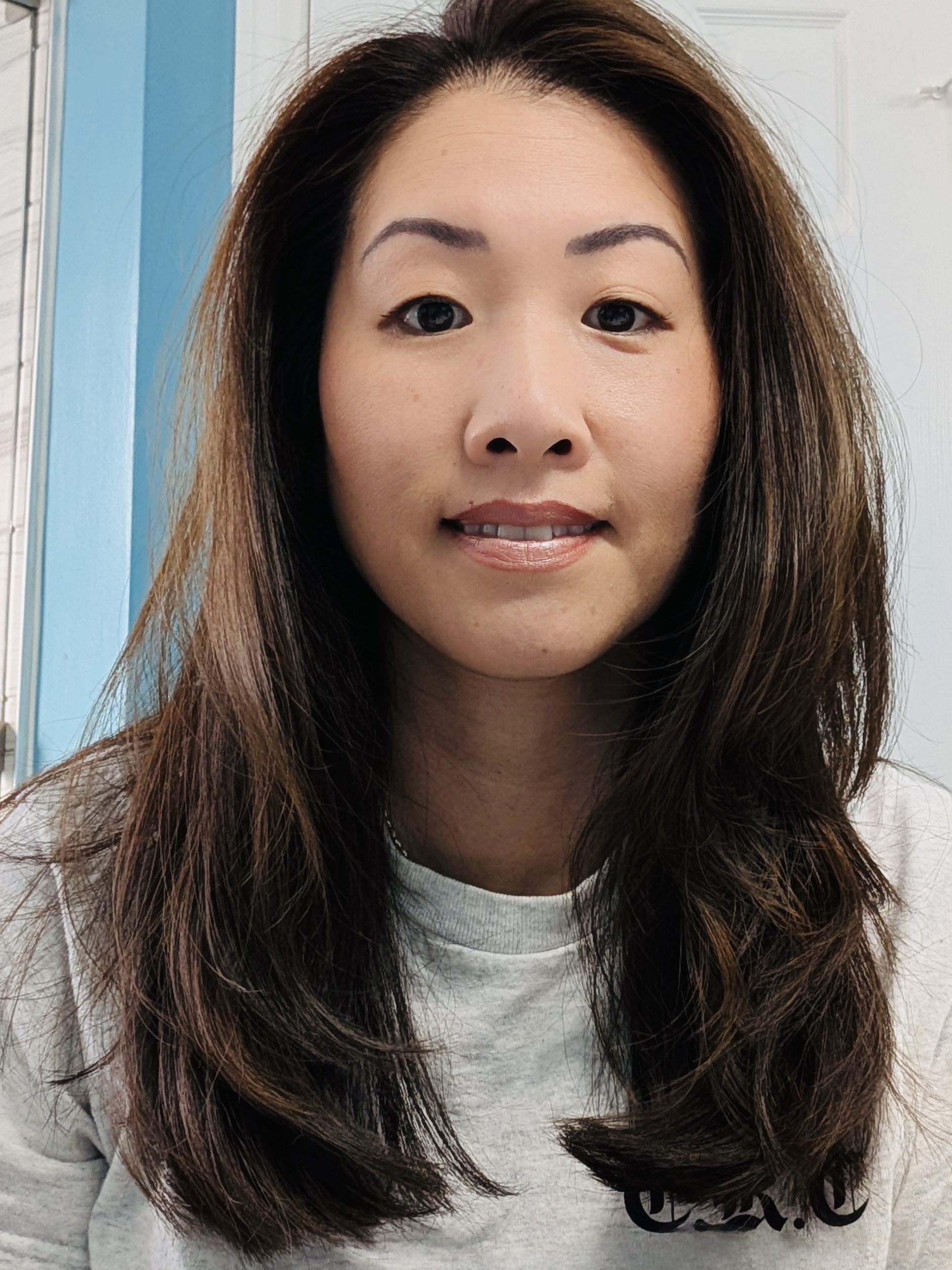 Chocolate brown hair transformation from honey blonde using Keune Tinta color with butterfly haircut at Salon International Charleston SC.