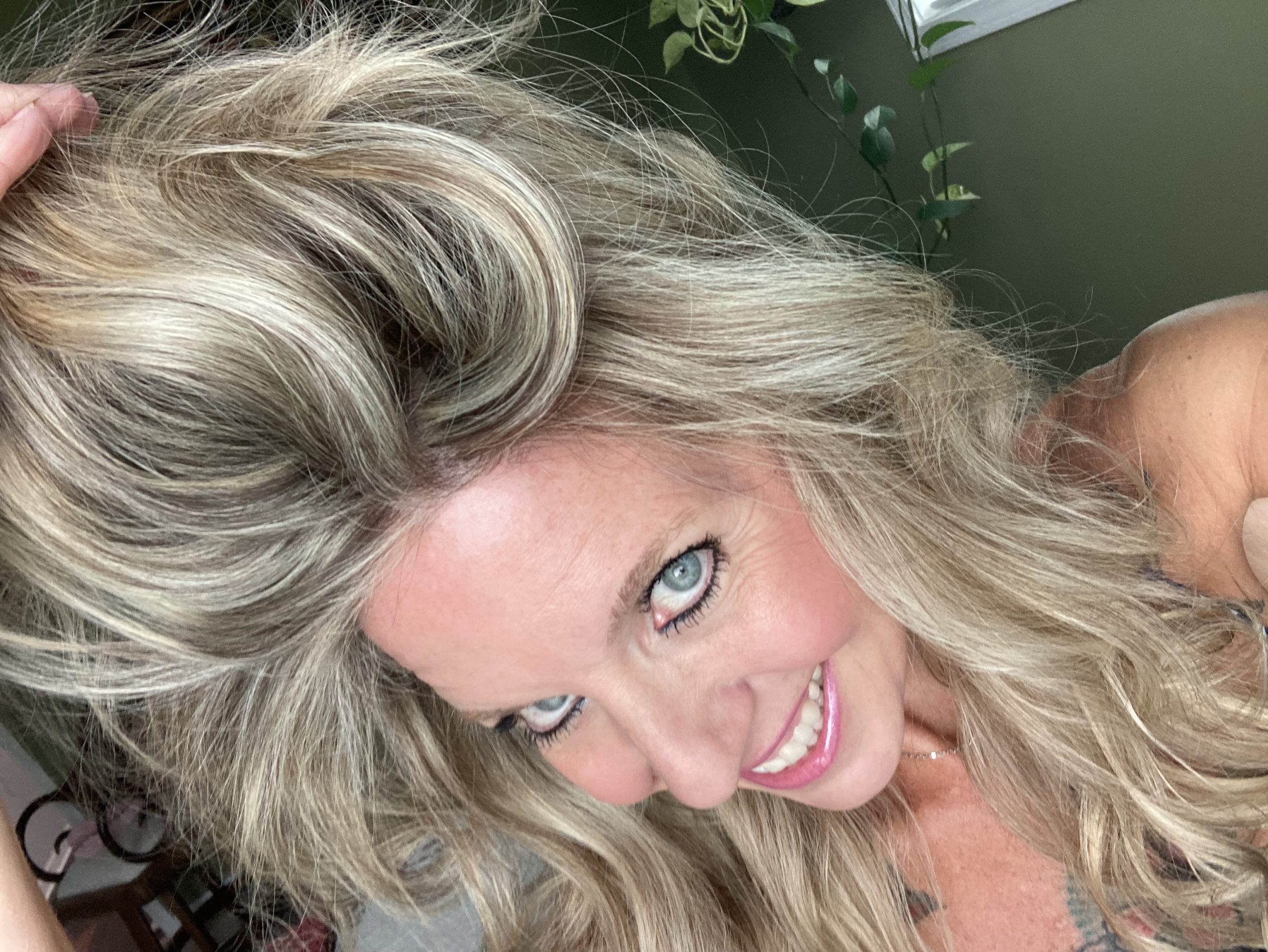 Professional blonde hair transformation showing the highlighting process, foil application, toning, and finished dimensional blonde result at Salon International in Mount Pleasant, South Carolina.